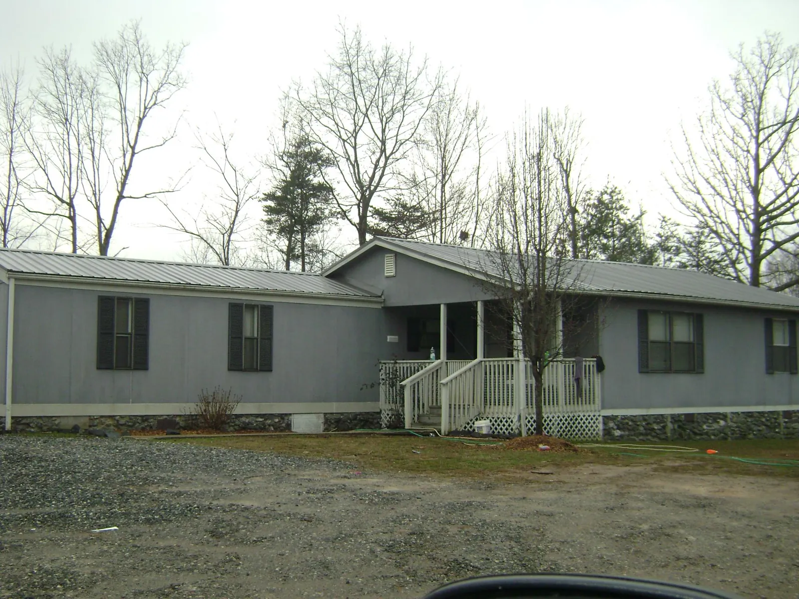Metal roof over a manufactured home with a covered front porch in Hackettstown